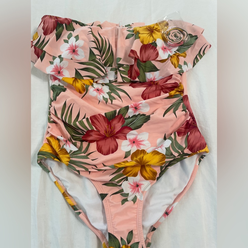 Strapless one piece swimsuit with removable straps. Floral print new w/tags